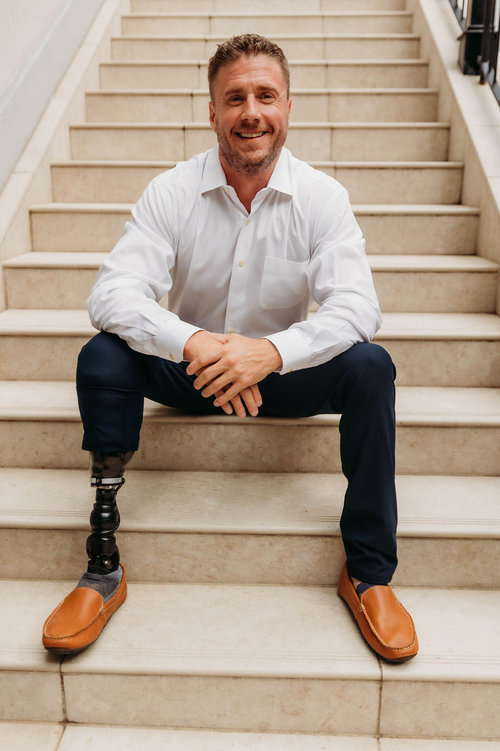 John Mabry seated on a staircase