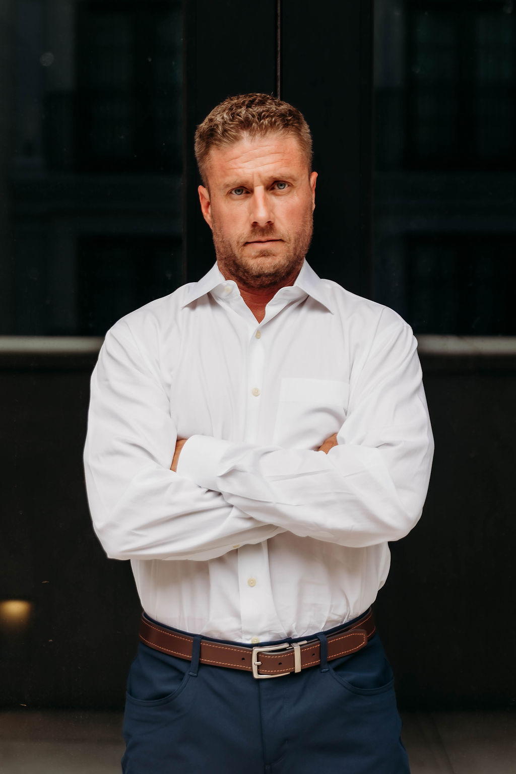 John Mabry standing with arms crossed
